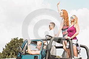 Young couples travelling by car