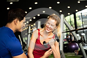 Young couples work out at the gym to strengthen the body