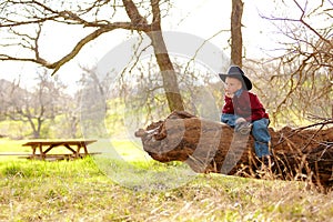 Young cowboy in countryside