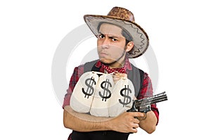 Young cowboy with gun and money bags isolated on