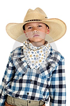 Young cowboy with a serious look wearing a large h