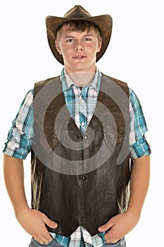 Young cowboy in vest looking