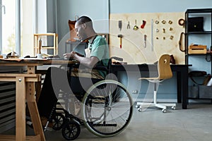 Young Craftsman Using Wheelchair photo