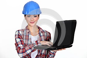 Young craftswoman with laptop