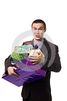 Young crazy man with many presents
