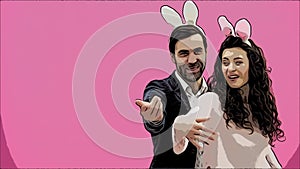 Young creative couple on pink background. With hackneyed ears on the head. During this time, they show the gestures of