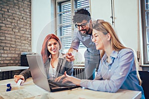 Young creative coworkers working with new startup project