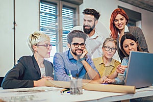 Young creative coworkers working with new startup project