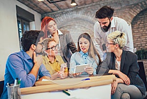 Young creative coworkers working with new startup project