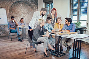 Young creative coworkers working with new startup project