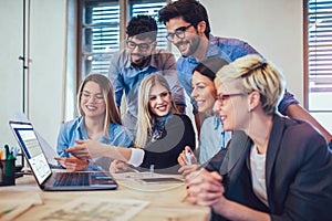 Young creative coworkers working with new startup project