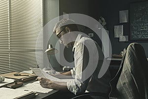 Young creative mathematician working in the office photo