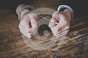 Young criminal in handcuffs, close up of hands - Image