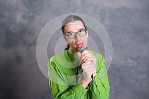 Crooner in green shirt and necktie