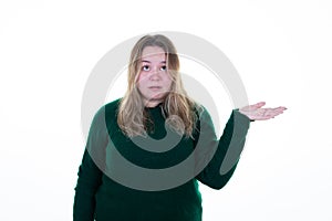 Young curvy blond woman on white background presenting an idea product in hand palm side copy space