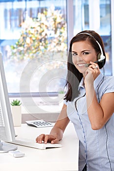 Young customer service operator working smiling