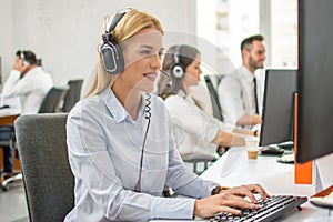 Young customer service operators working in office