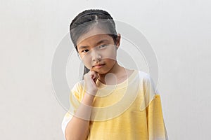 Young and cute Asian girl thinking