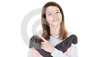 Young cute beautiful caucasian woman pointing to copy space isolated on white background