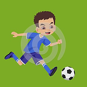 Young boy junior soccer player running the football photo