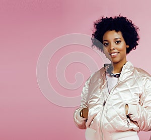 Young cute disco african-american girl on pink background smiling adorable emotions copyspace, lifestyle people concept