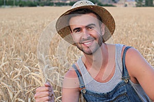 Young cute farmer boy in the fields