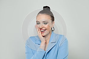Young cute happy laughing woman brunette studio portrait