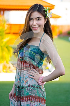 Young cute summer girl on green grass