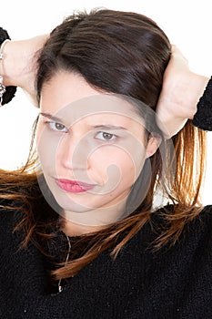 Young cute woman face over white background Relaxing and stretching with arms and hands behind head