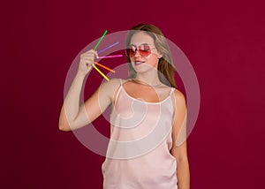 Young cute woman with markers, studio