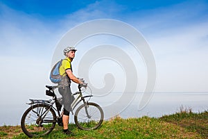 Young cyclist cycling in the spring park