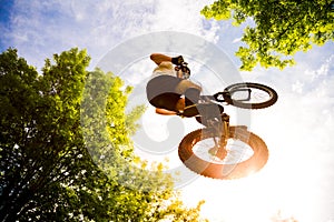 Young cyclist doing an extreme jump