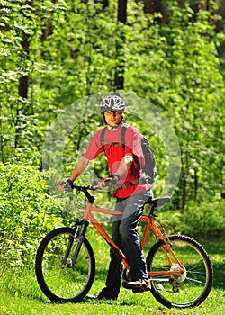 A young cyclist in the woods