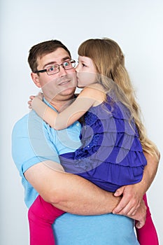 Young dad and his beloved daughter kissing