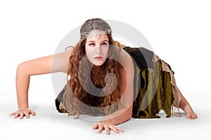 Young dancer crouching in fairy-inspired costume