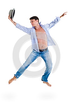 Young dancer jumping against isolated white