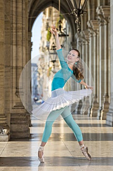 Young dancer with tutu and turqoise trikot