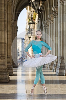 Young dancer with tutu and turqoise trikot photo