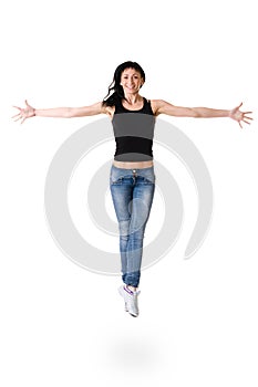 Young dancer woman jumping against white background