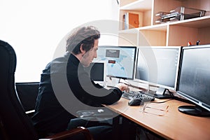 The young dangerous hacker breaks down government services by downloading sensitive data and activating viruses. A man