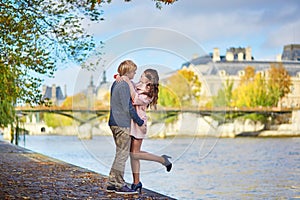 Young dating couple in Paris on a bright fall day