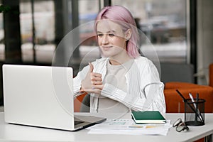 Young deaf businesswoman have digital virtual online conference with employees on computer, talking on video call