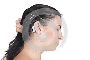 Young deaf or hearing impaired woman with cochlear implant