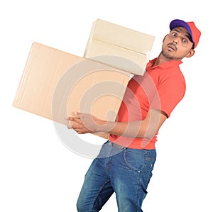Young delivery man carrying carton boxes in uniform