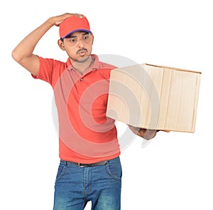 Young delivery man holding carton box in uniform