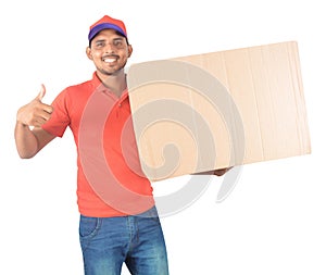 Young delivery man holding carton box in uniform