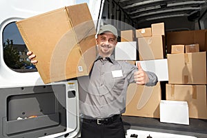 Young delivery man with a parcel.