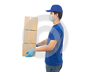 Young Delivery man wearing mask and medical gloves holding paper cardboard box mockup