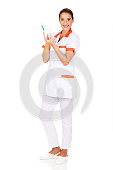 Young dentist woman with toothbrush and tooth model