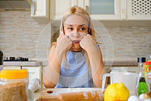 young desperate housewife in her kitchen